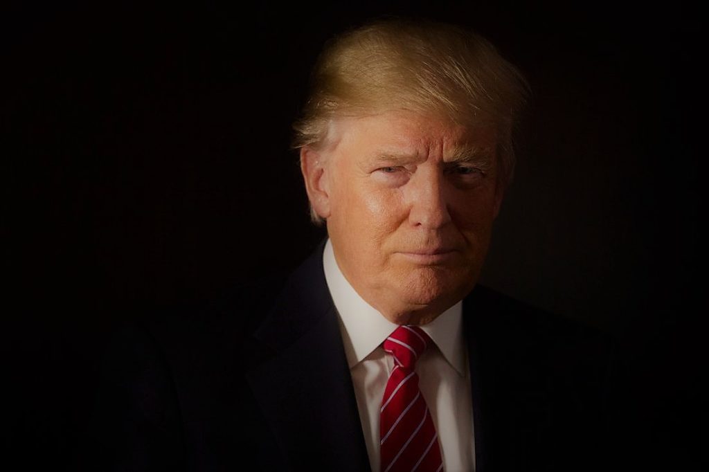 Donald Trump, president and chief executive of Trump Organization Inc. and 2016 Republican presidential candidate, stands for a photograph after a Bloomberg Television interview at his campaign headquarters in Trump Tower in New York, U.S., on Thursday, Oct. 15, 2015. According to Trump, Janet Yellen's decision to delay hiking interest rates is motivated by politics. Photographer: John Taggart/Bloomberg via Getty Images *** Local Capton *** Donald Trump